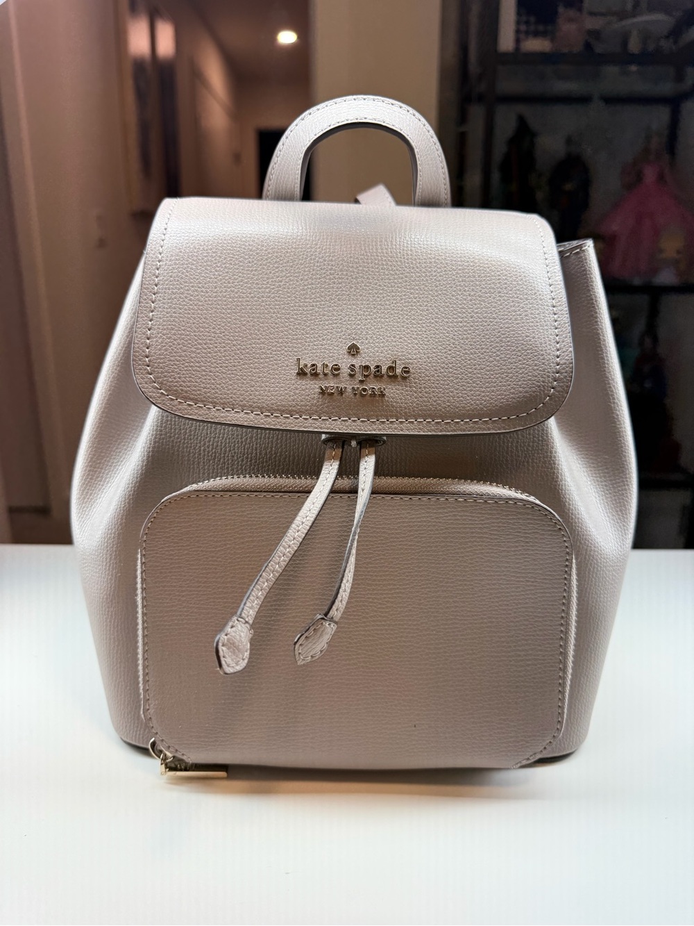 kate spade Pebbled Cream Leather Mini Backpack with Front Pocket